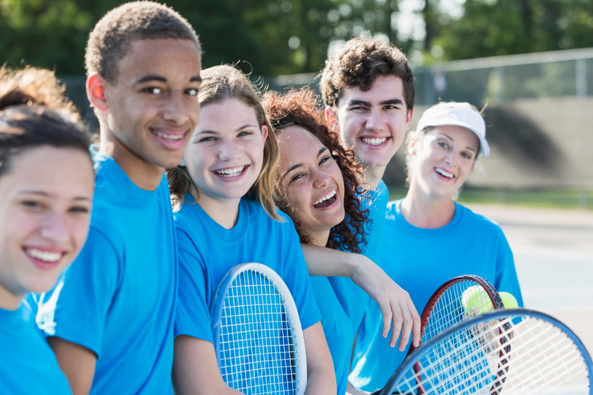 High school tennis team with coach.